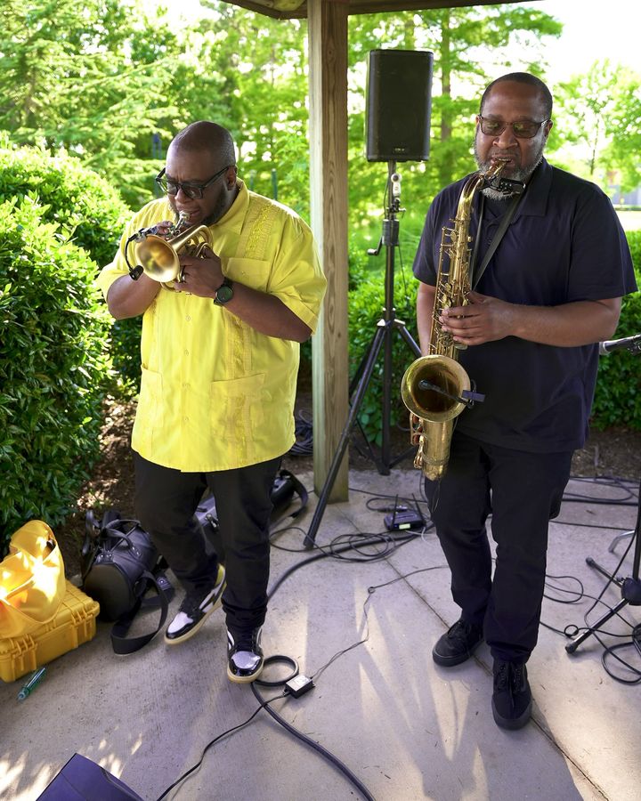 A Fuzz Band horn player.