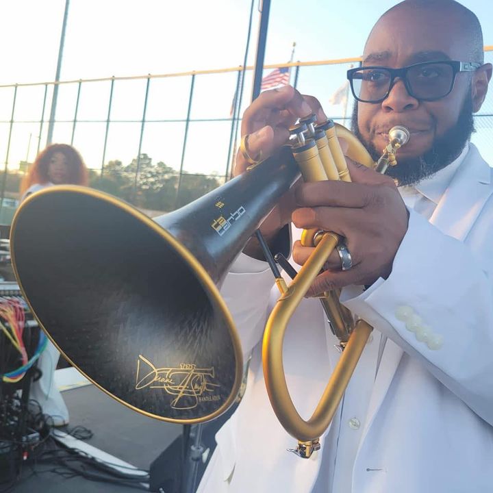 A Fuzz Band horn player.