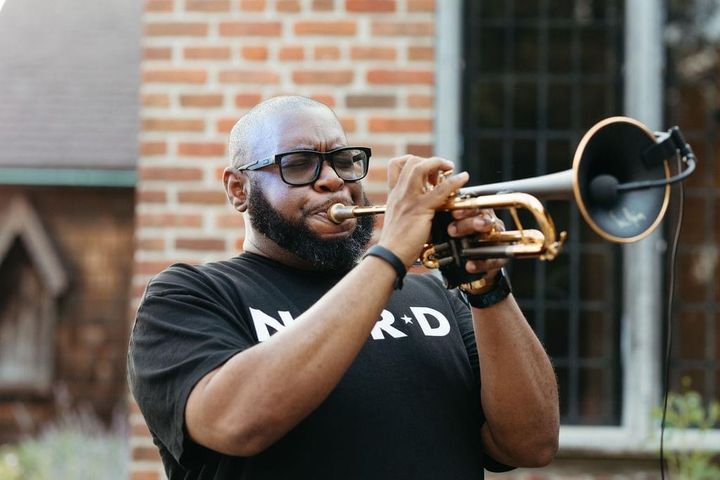 A Fuzz Band horn player.